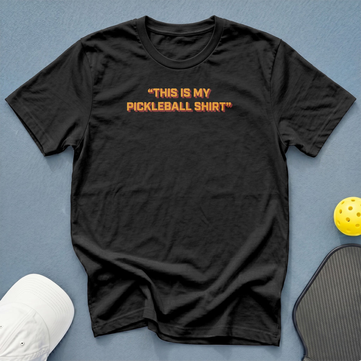 Black t-shirt with "THIS IS MY PICKLEBALL SHIRT" text, pickleball, and paddle.