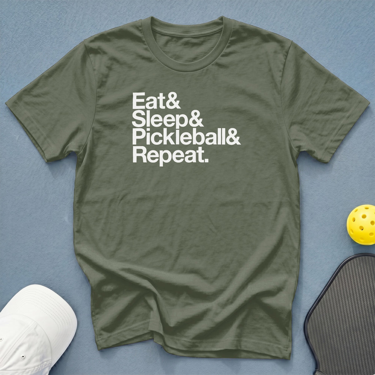Olive t-shirt with white text: Eat & Sleep & Pickleball & Repeat.
