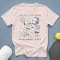 Light pink t-shirt with black graphic of pickleball gear and text "HAVE WE TALKED ABOUT PICKLEBALL YET?".