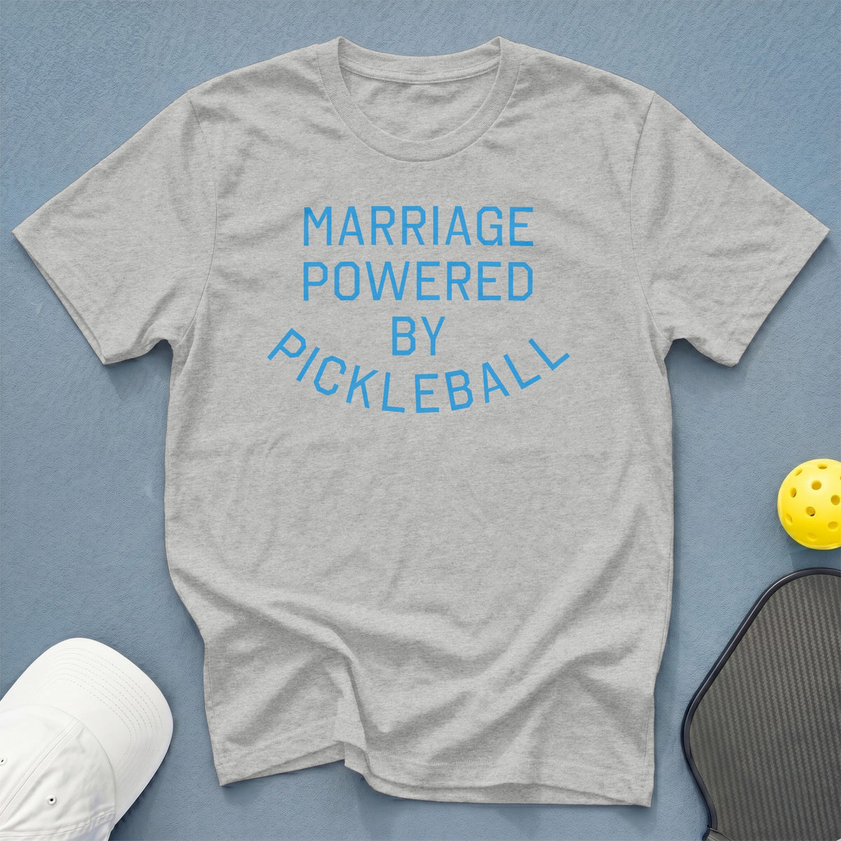 Grey t-shirt with blue text "MARRIAGE POWERED BY PICKLEBALL".