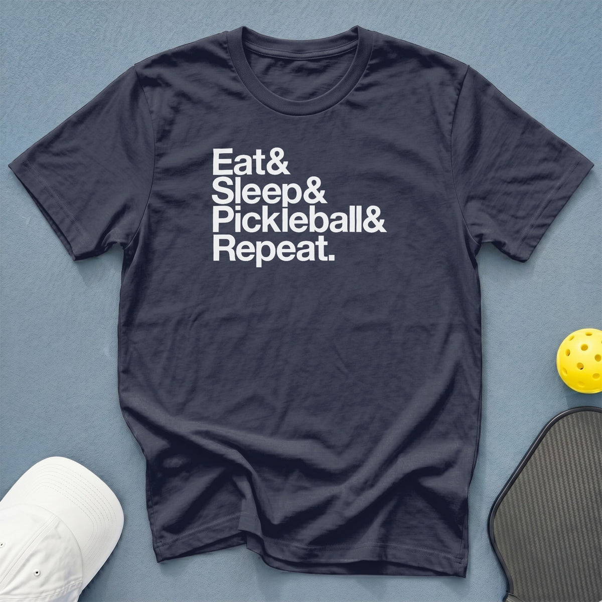 Navy t-shirt with white text: Eat & Sleep & Pickleball & Repeat.