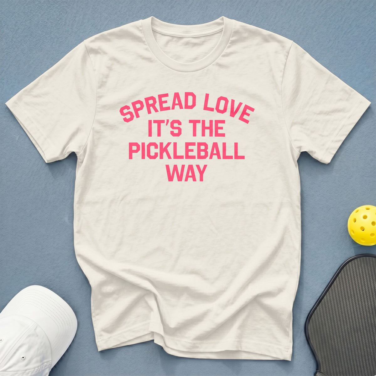 White t-shirt with pink text "Spread Love It's The Pickleball Way."
